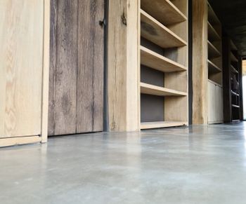 stucco floors and oak shelves